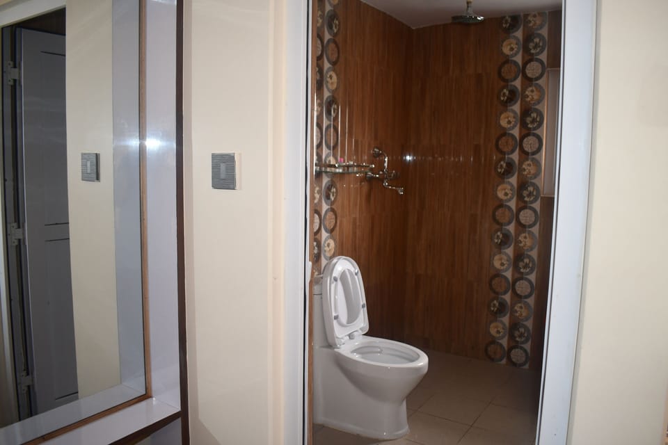 Shower, rainfall showerhead, slippers, towels