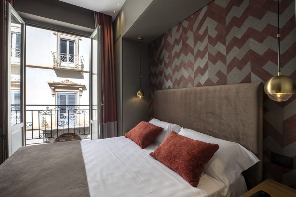 Deluxe Double or Twin Room | Minibar, in-room safe, blackout drapes, soundproofing