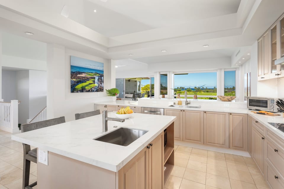 Your spacious kitchen features modern appliances in a bright and sun-filled setting.