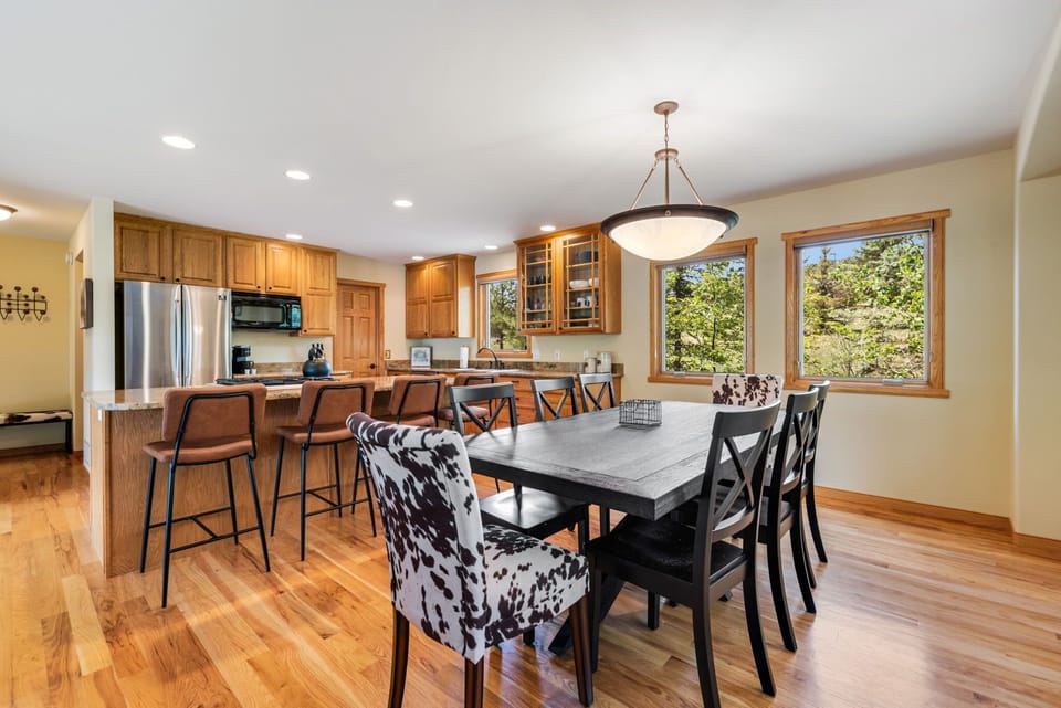 Seating for 4 at the kitchen island, perfect for casual drinks. Enjoy seating 8 at the dining table