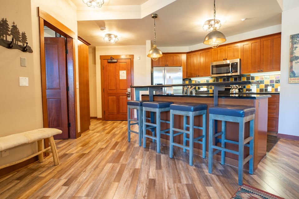 Premier Condo, One Bedroom with Den | Private kitchen | Coffee/tea maker, highchair