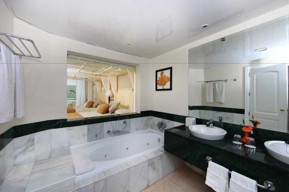 Separate tub and shower, jetted tub, free toiletries, hair dryer