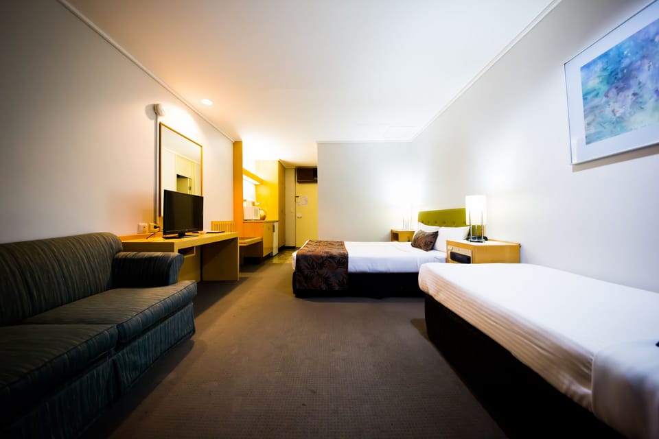 Standard Twin Room | Desk, blackout drapes, soundproofing, iron/ironing board