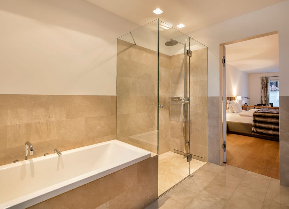 Superior Suite, 1 King Bed | Bathroom | Hair dryer, bathrobes, slippers, towels