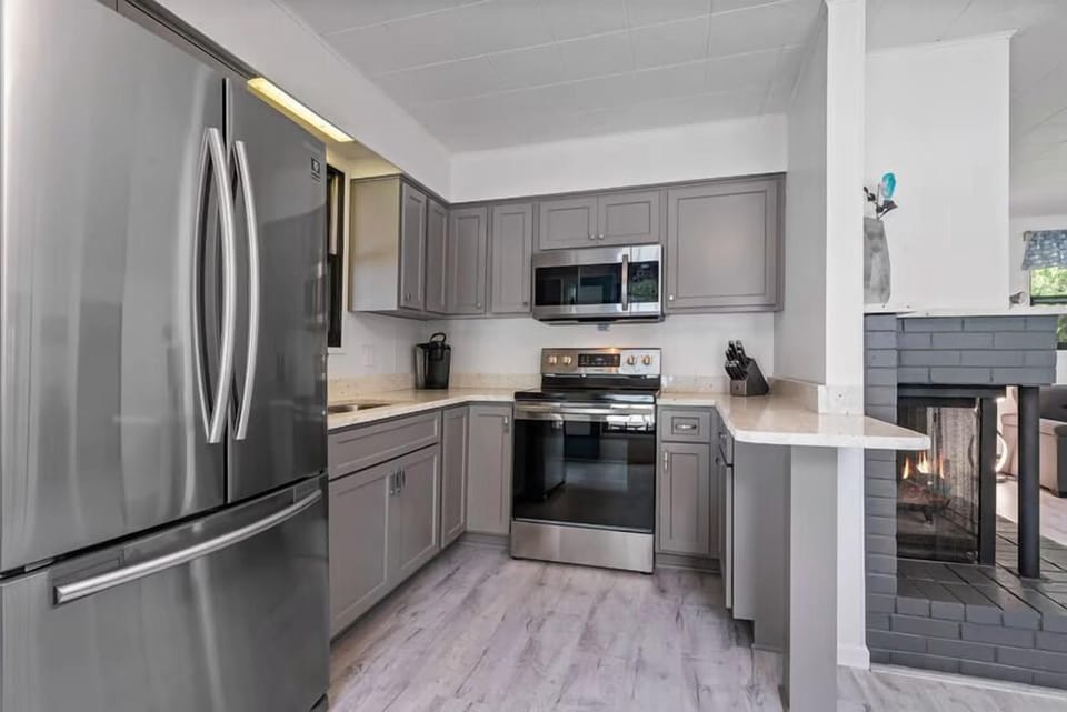 Fully equipped kitchen with stainless appliances and granite countertops — everything you need for family meals.