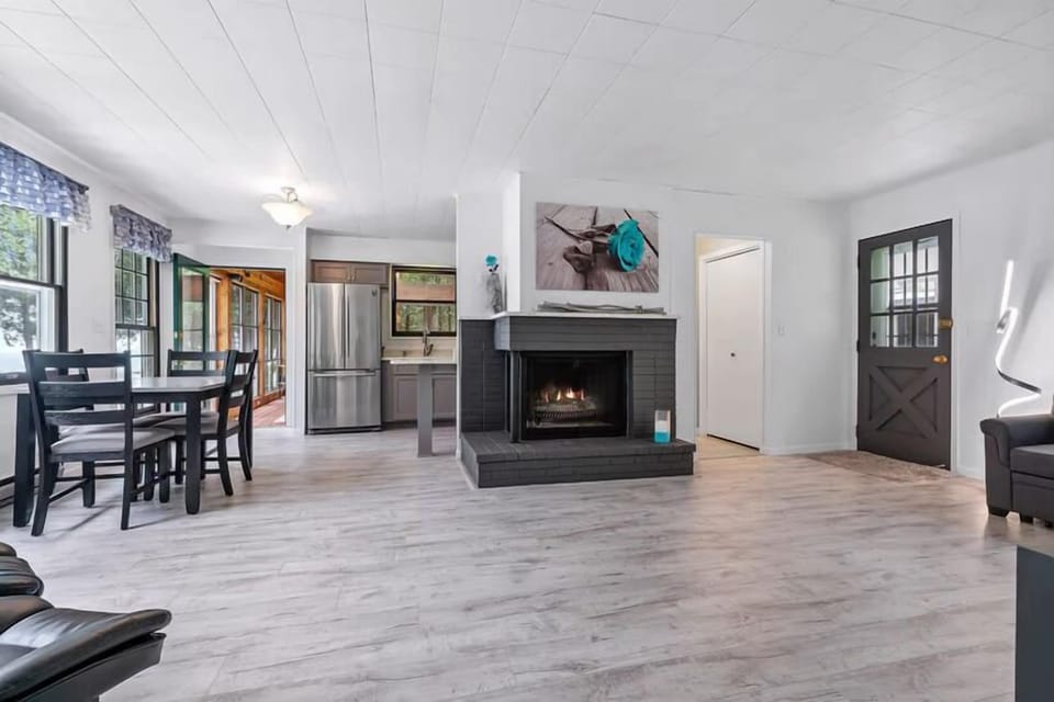 Spotless kitchen with stainless appliances and granite countertops — fully stocked for home-cooked meals.