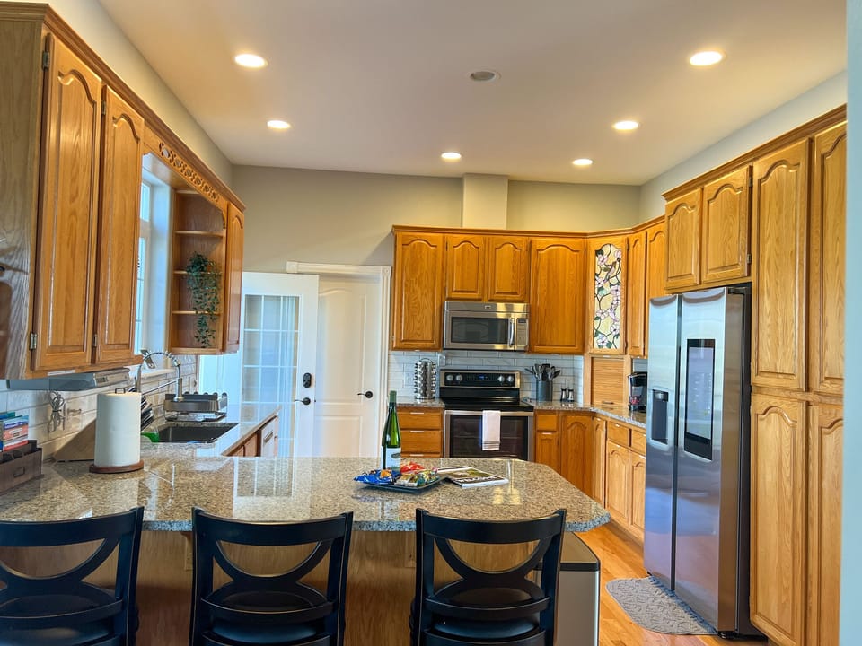 Main Kitchen: Stocked with all necessary tools & smart fridge, view of the lake 