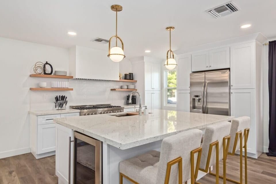 The kitchen is stocked with basic cooking supplies and plenty of dinnerware/silverware for large groups.