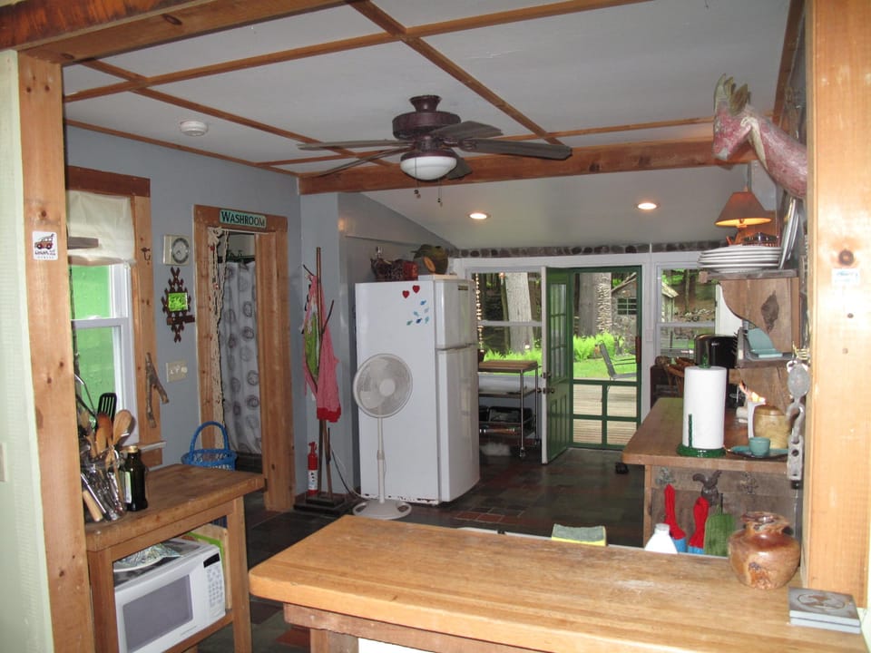 Counter looking thru kitchen, leading to back patio decks.