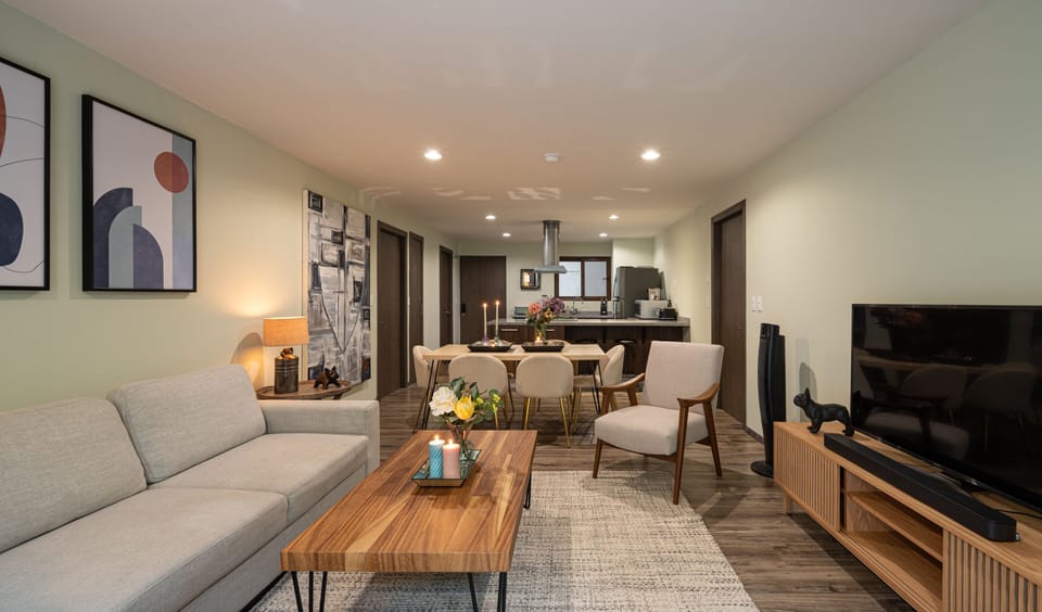 Superior Apartment | Living area | 50-inch Smart TV with cable channels, TV, Netflix