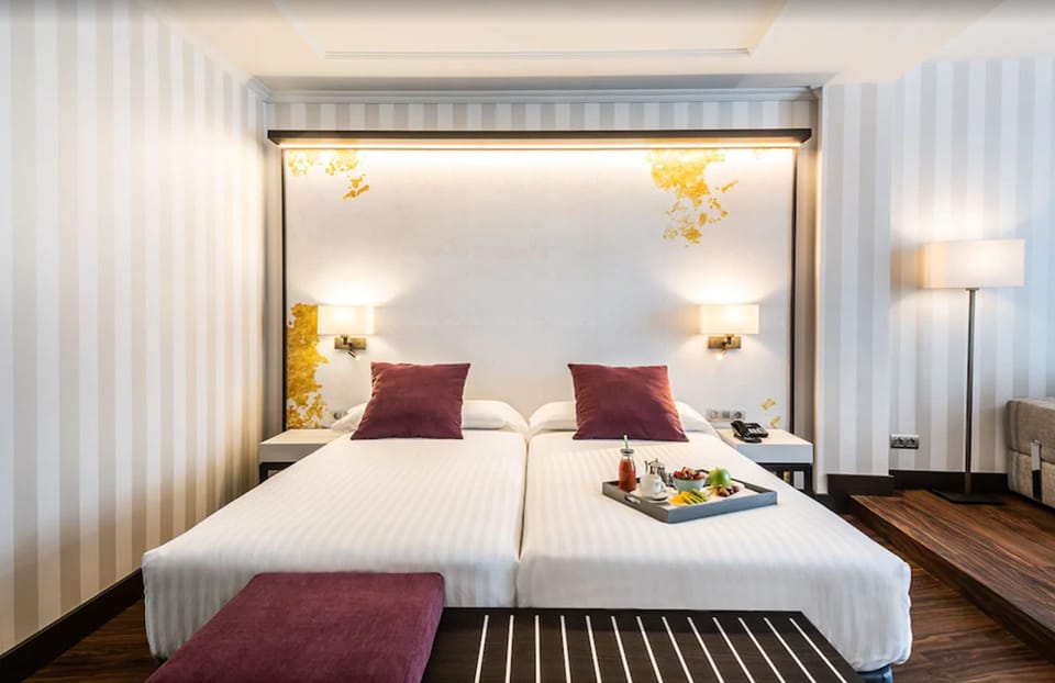 Junior Suite, 2 Twin Beds, Balcony | Minibar, in-room safe, individually decorated, individually furnished