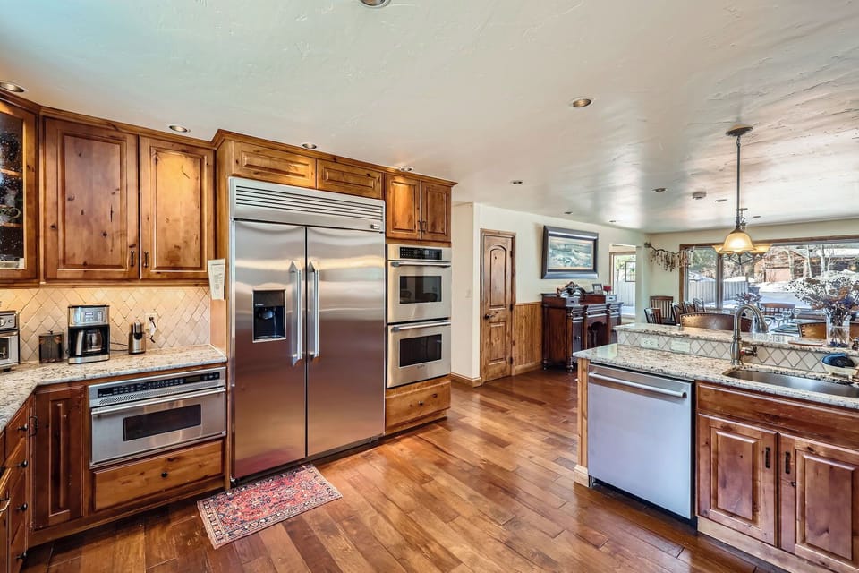 Huge kitchen with two Bosch dishwashers and large dining room