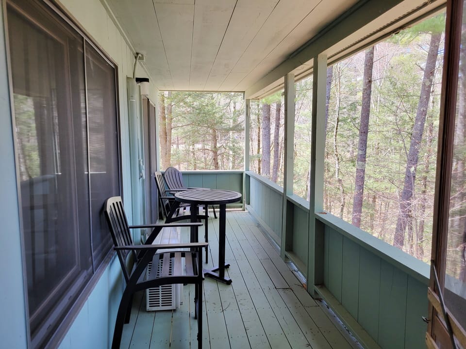 Lower deck access from living area to master bedroom