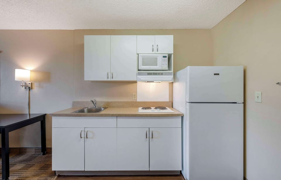 Fridge, microwave, stovetop, coffee/tea maker