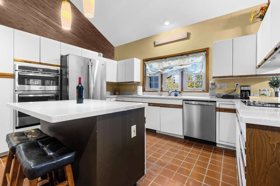 The small island offers convenient seating to have a glass of wine while making dinner.