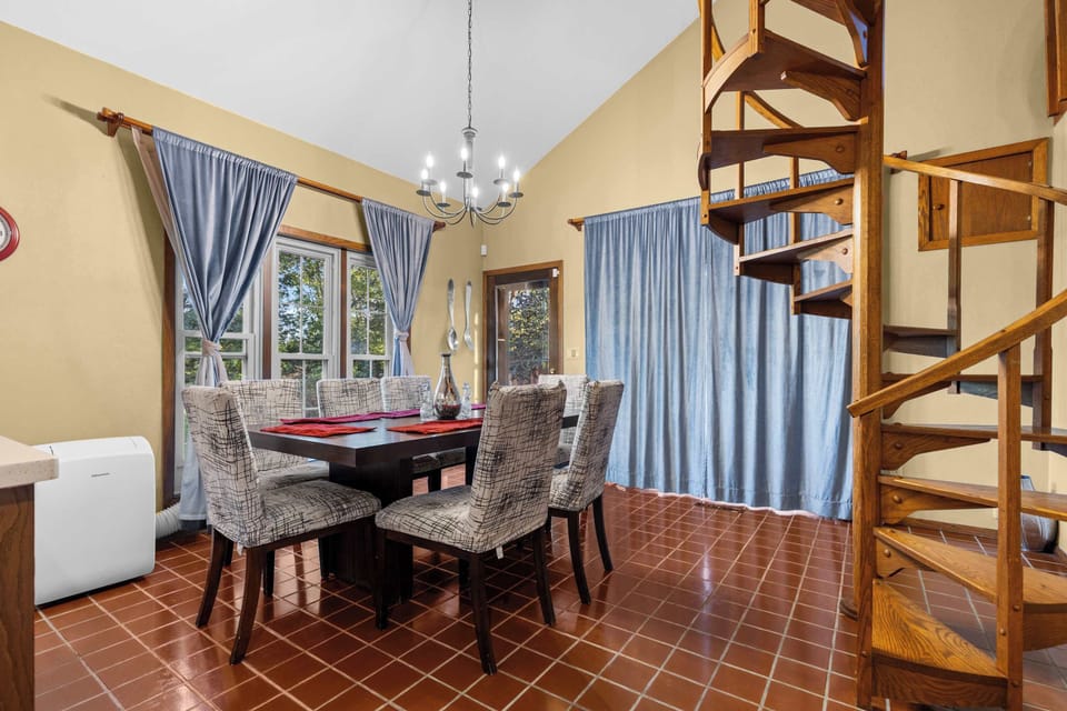 The dining room table for 6 is perfect for a family meal located right next to the kitchen.