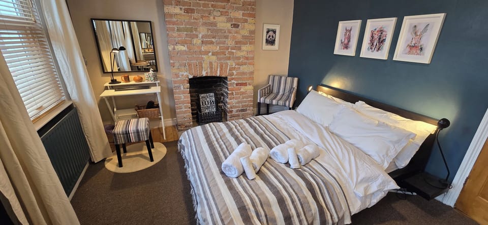 Master Bedroom with Decorative Fireplace