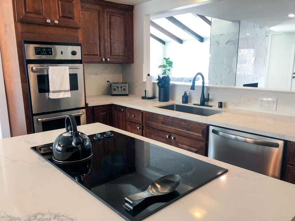 Double ovens and new appliances in the kitchen. 