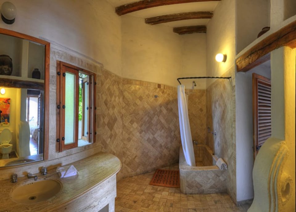 Luxury Suite, 1 Bedroom, City View | Bathroom | Eco-friendly toiletries, hair dryer (on request), towels, soap