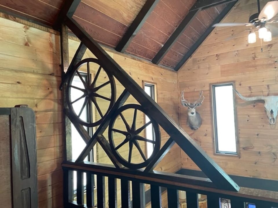 Loft: Custom stagecoach partial wheel wall for safety in the loft area.