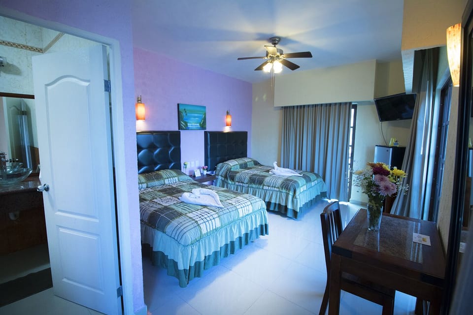 Premium Double Room, 2 Queen Beds, Balcony, City View | Minibar, in-room safe, desk