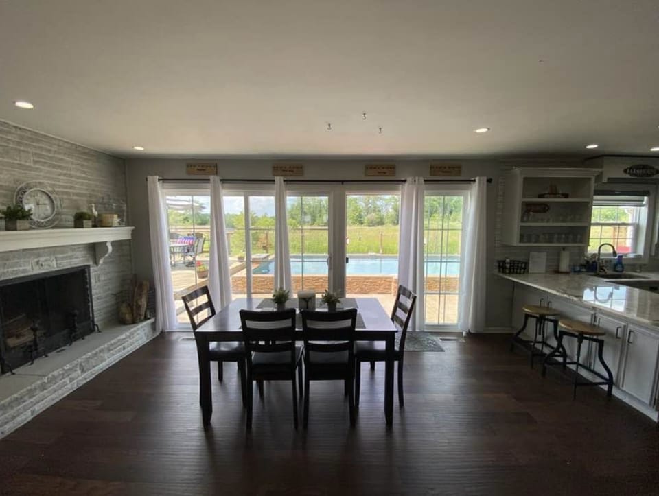 Dining area with fabulous views looking out over the Pool and Patio Space.  