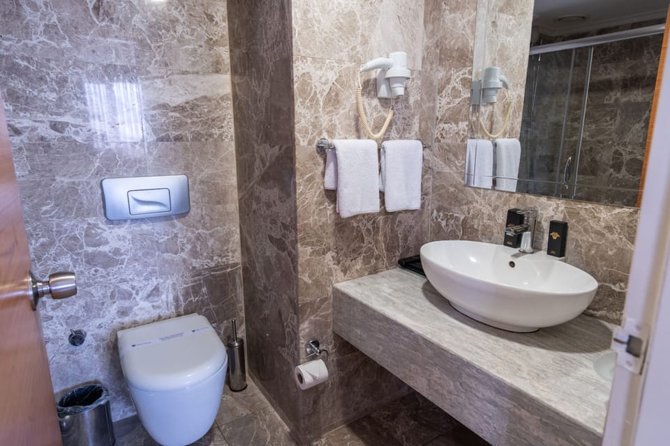 Shower, free toiletries, hair dryer, slippers