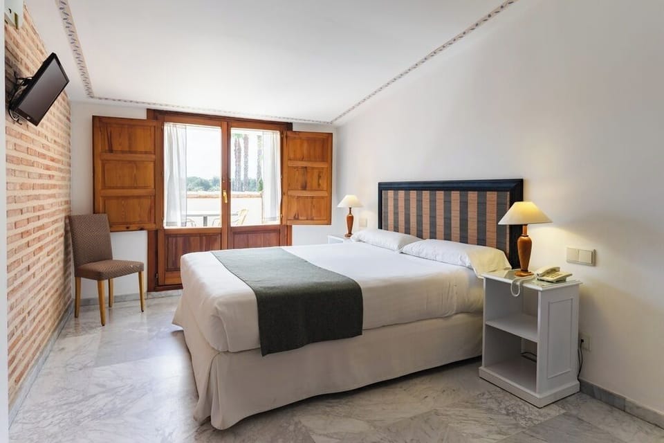 Superior Double or Twin Room, Balcony, Golf View | Minibar, in-room safe, desk, iron/ironing board