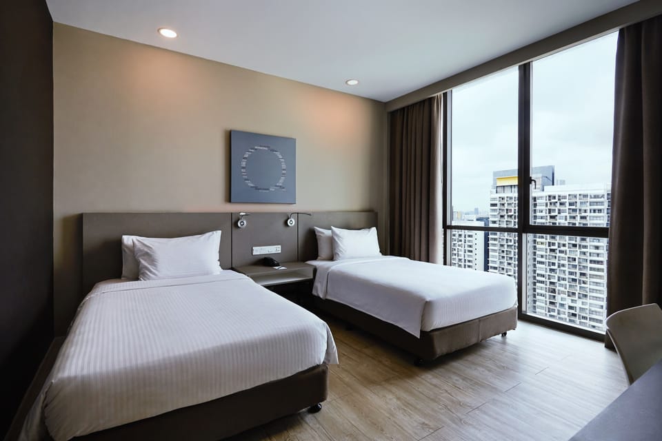 Superior Twin Room | Minibar, in-room safe, desk, iron/ironing board