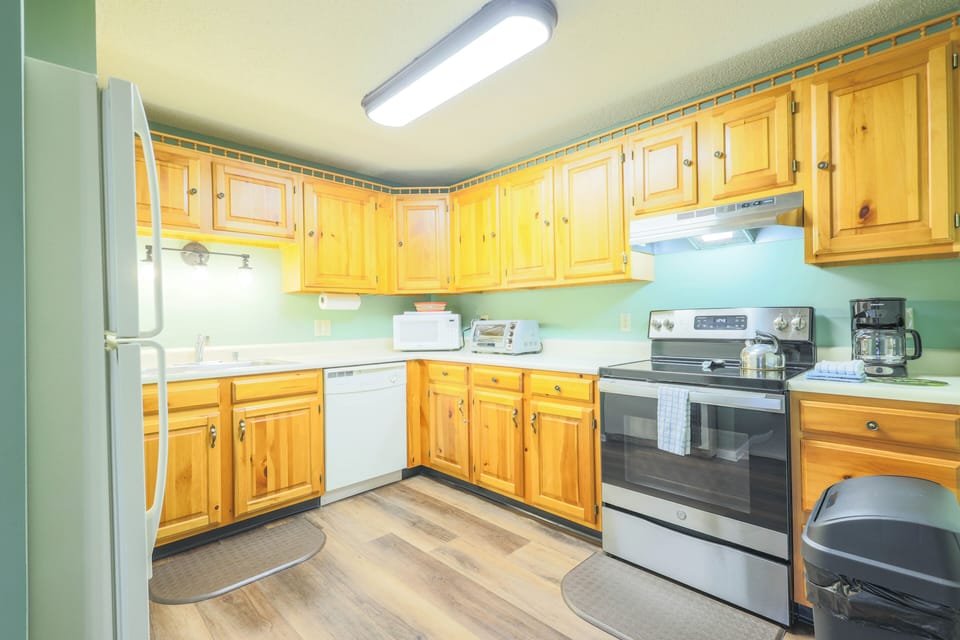 Kitchen has full size appliances, flatware, dishware, glassware, cooking utensils and pots & pans.
