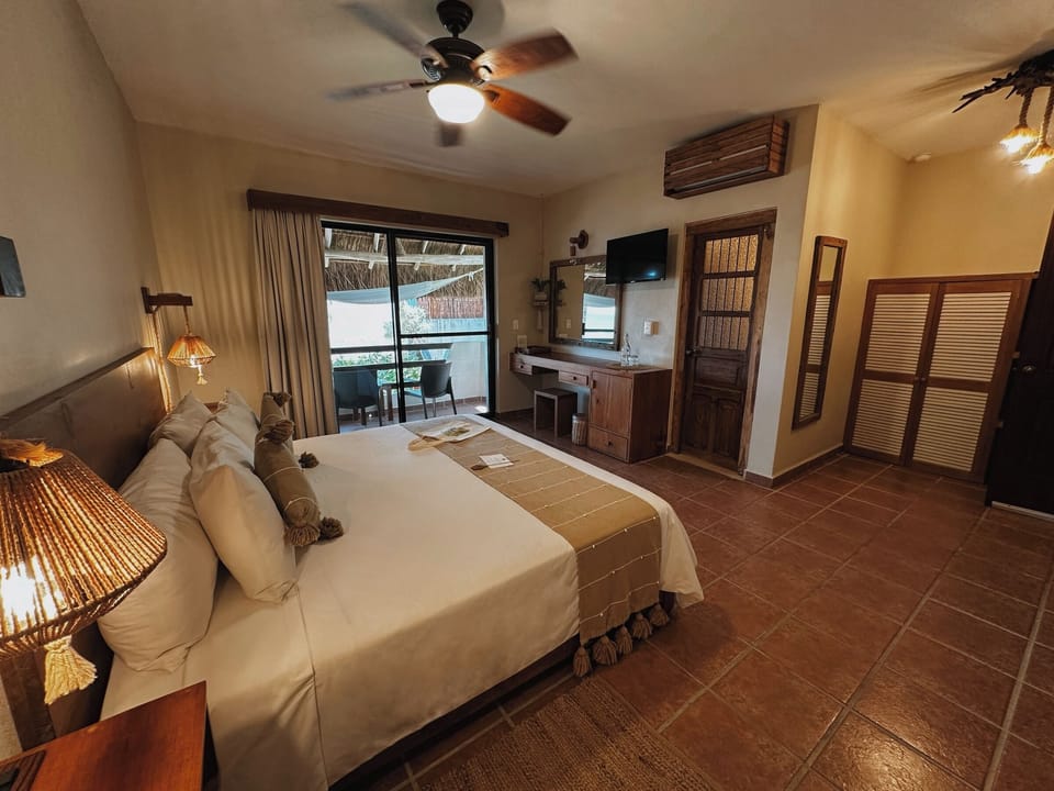 Superior Room, 1 King Bed, Partial Ocean View | Minibar, in-room safe, free WiFi, bed sheets