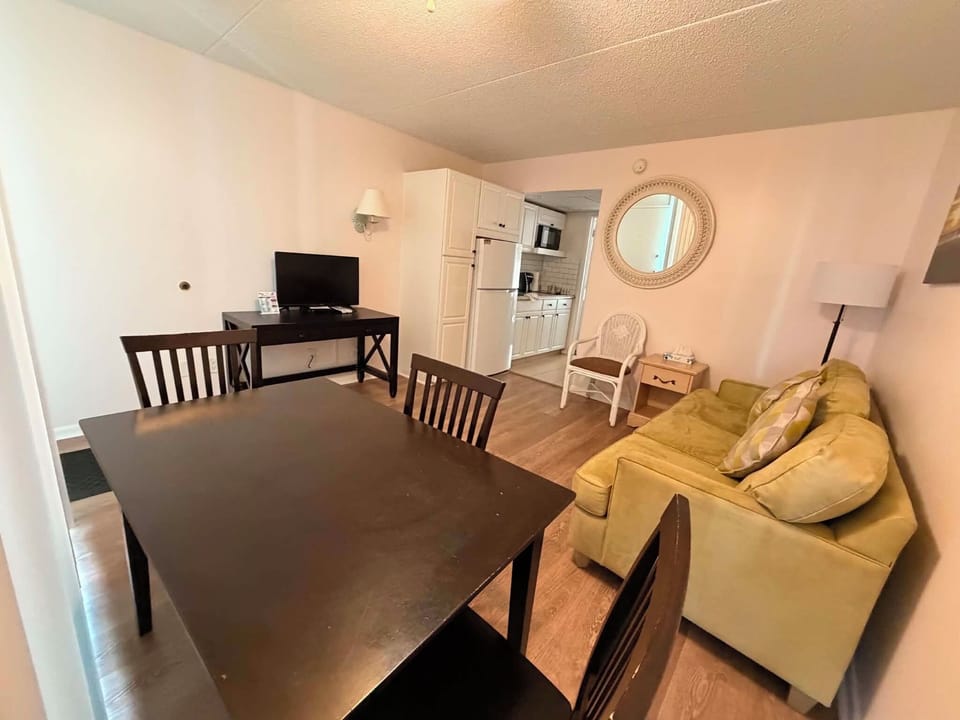 1 Bedroom Suite, Living Room, Kitchen | Living area | Flat-screen TV