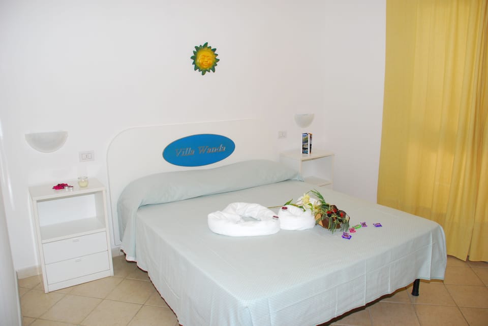 Minibar, desk, bed sheets