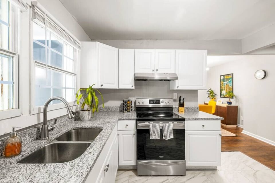 Kitchen elegance: Brand new stainless steel appliances for a sleek, modern cooking experience.