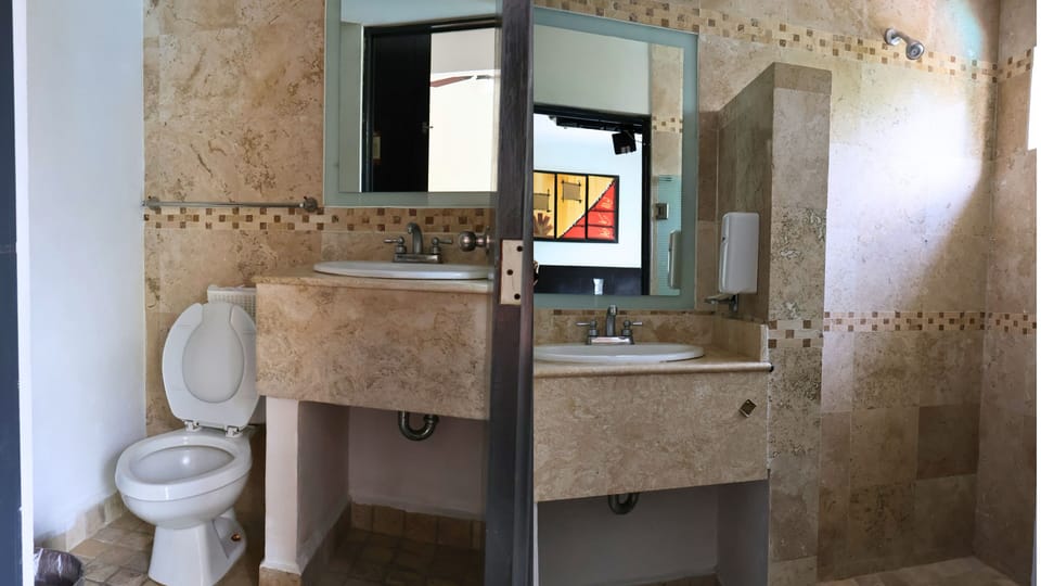 Standard room with fan | Bathroom | Shower, towels, soap, shampoo