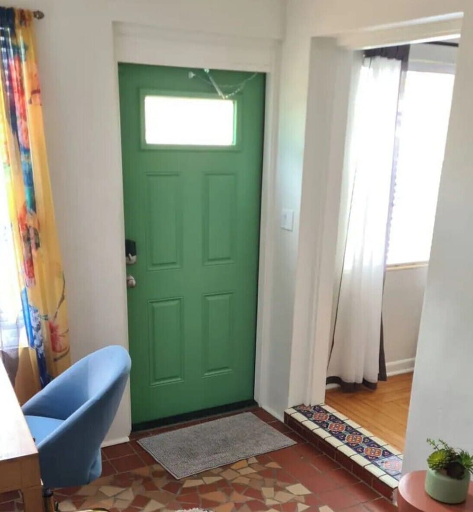 Front porch guest room shares the front door and living room entryways.