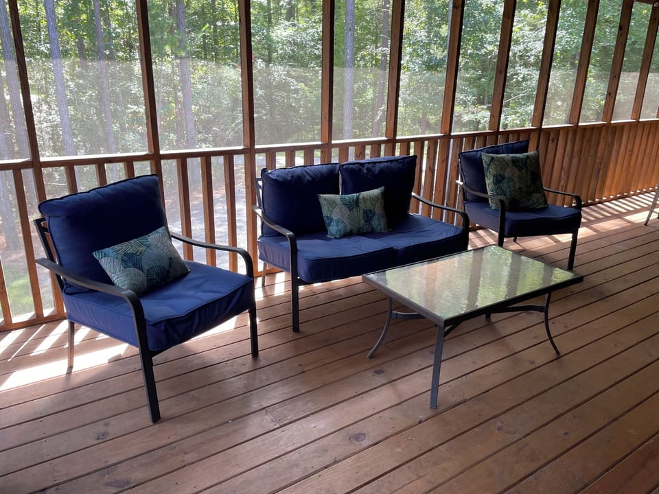 Chairs facing tv (screened in porch)