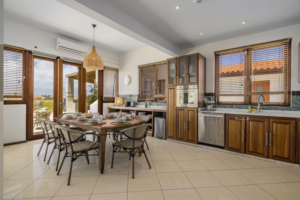 There is a large dining area that can seat up to 6 people. Serve your favorite meal at this 6 seater glass top dining table.