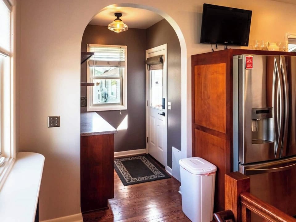 Back entrance - access street-side parking, gas grill, lounge chairs and fire table in your private backyard oasis!