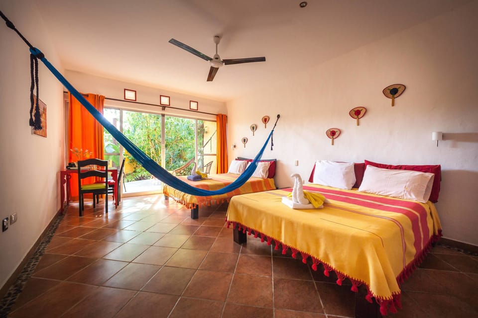Family Room, 2 Queen Beds (with AC) | Minibar, in-room safe, desk, blackout drapes