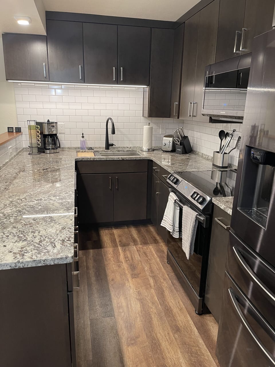 A newly updated kitchen with granite countertops