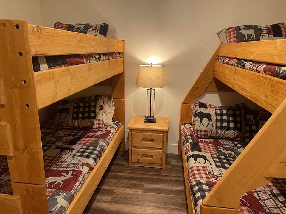 Twin over twin and twin over double bunk beds in the bedroom