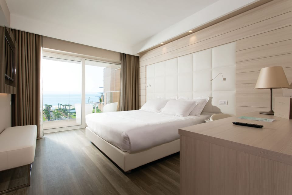 Family Room (2 Adults + 2 Children) | Minibar, in-room safe, desk, blackout drapes