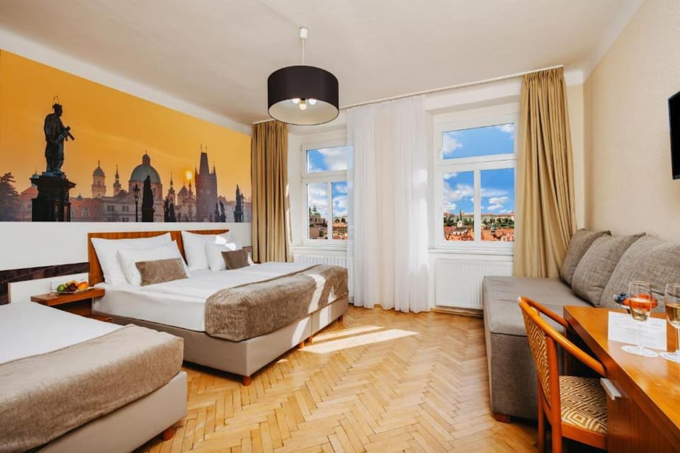 Quadruple Room | Minibar, in-room safe, desk, laptop workspace