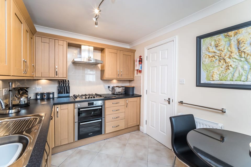 The beautiful kitchen is equipped with high quality appliances