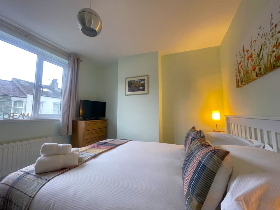 The bedroom has plenty of storage available as well as a king sized bed