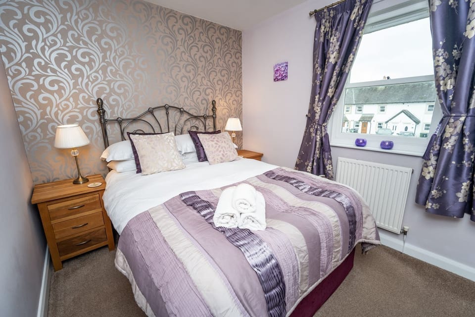The double bedroom enjoys views over Elliott Park