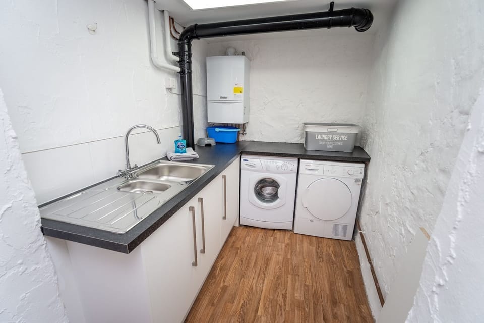 This handy utility area can be used to store bikes and prams