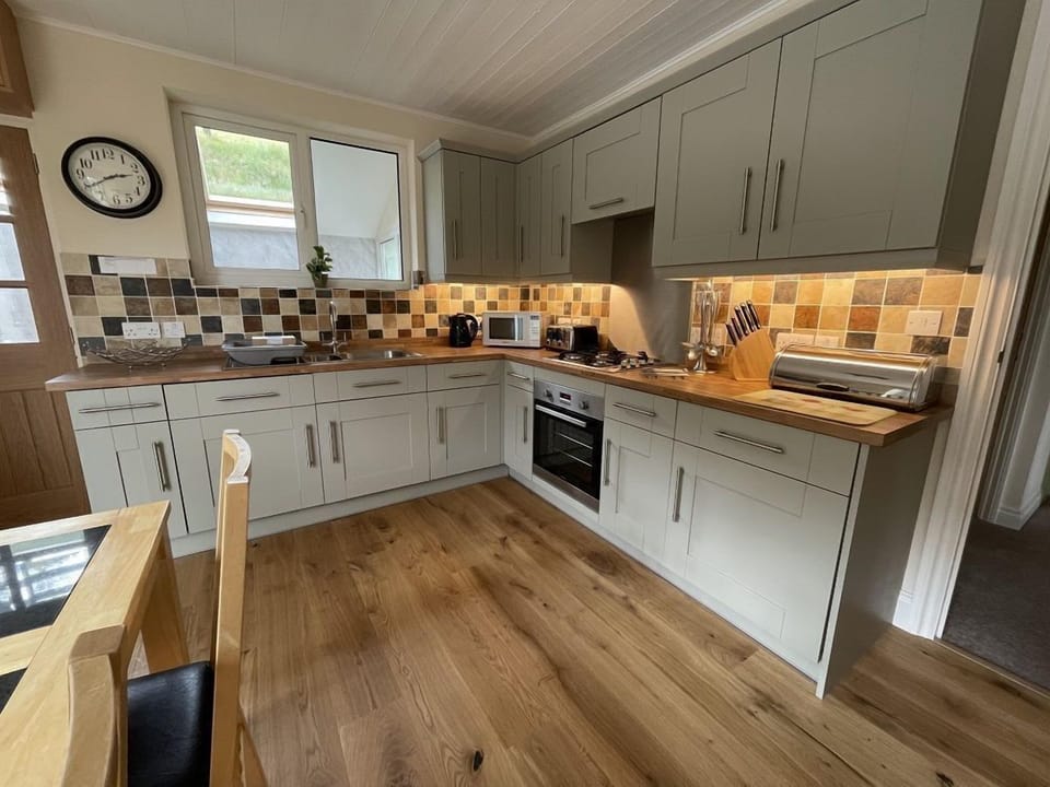 The spacious open plan kitchen and dining room is to the rear of the property