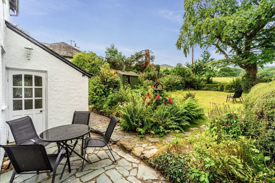 Rose Bank Cottage has beautiful gardens to the front and rear of the property